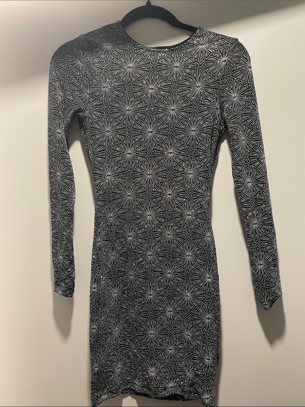 Sparkly long sleeve open back mini dress